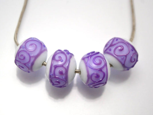 white purple lampwork glass rondelle bead handmade artisan lampwork bead set jewelry making earrings violet curl texture swirl carved beads