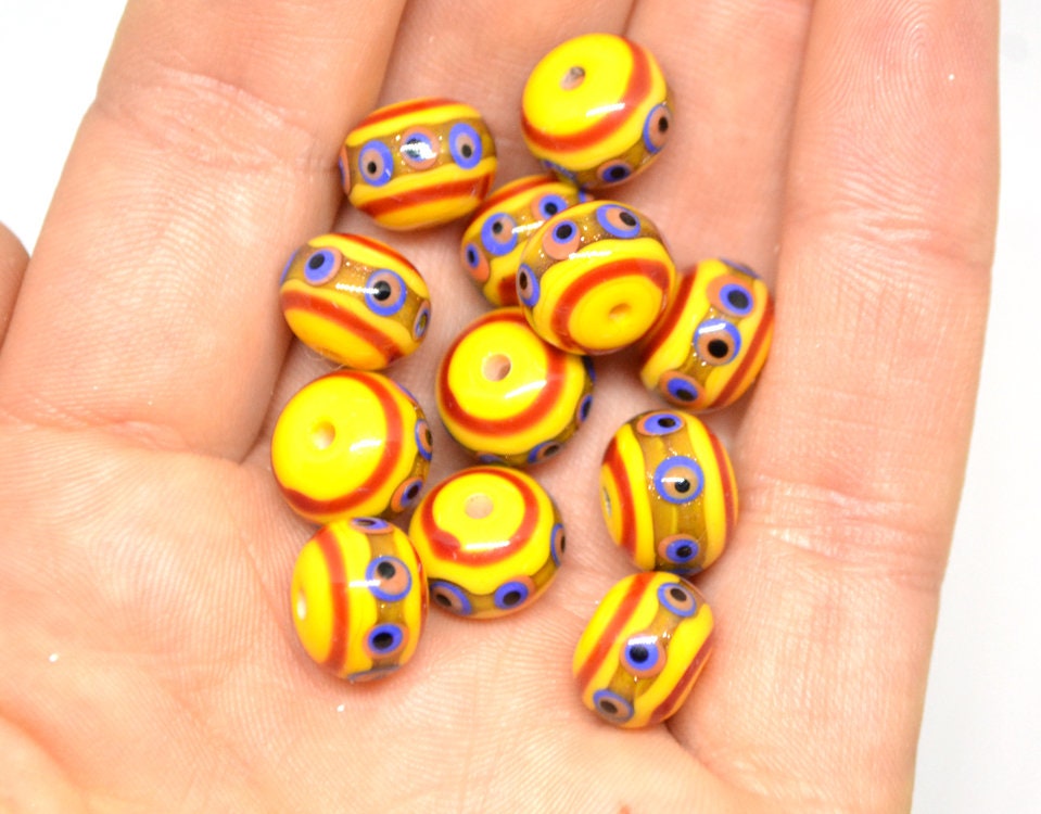 Yellow glass beads, red srtipes, Yellow lampwork beads, Rondelle glass beads, Blue dots, devil eye beads, Handmade beads