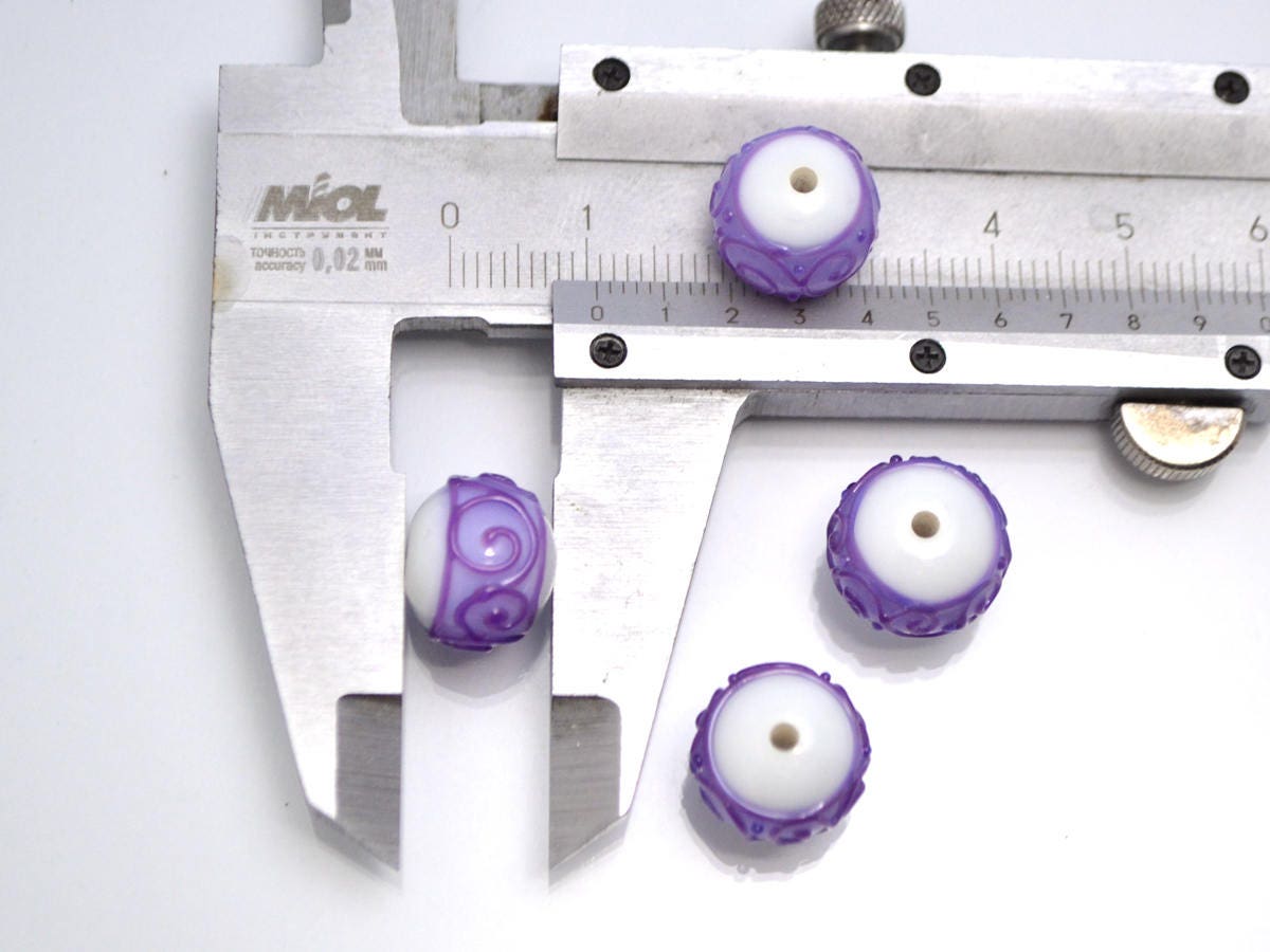 white purple lampwork glass rondelle bead handmade artisan lampwork bead set jewelry making earrings violet curl texture swirl carved beads