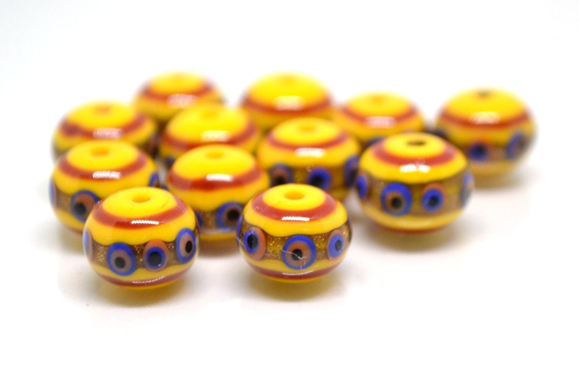Yellow glass beads, red srtipes, Yellow lampwork beads, Rondelle glass beads, Blue dots, devil eye beads, Handmade beads
