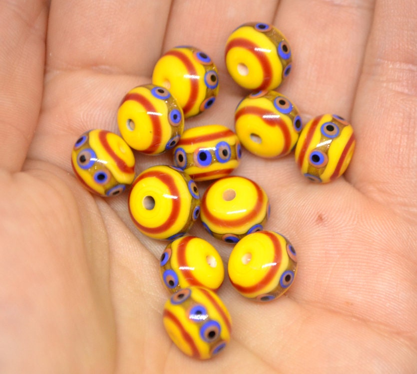 Yellow glass beads, red srtipes, Yellow lampwork beads, Rondelle glass beads, Blue dots, devil eye beads, Handmade beads