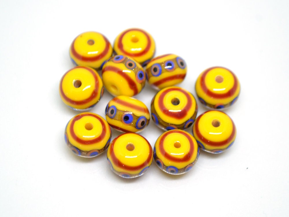 Yellow glass beads, red srtipes, Yellow lampwork beads, Rondelle glass beads, Blue dots, devil eye beads, Handmade beads