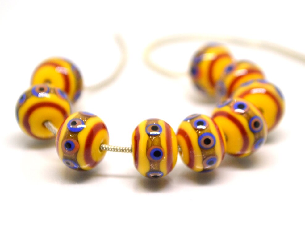 Yellow glass beads, red srtipes, Yellow lampwork beads, Rondelle glass beads, Blue dots, devil eye beads, Handmade beads