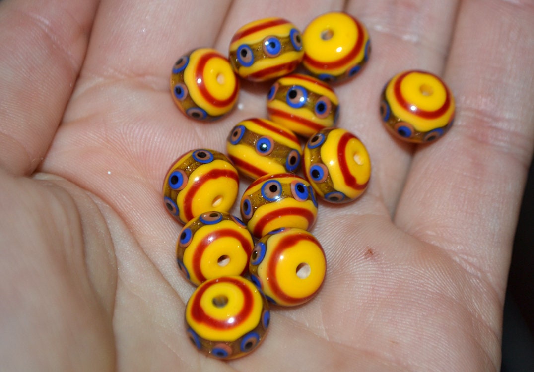 Yellow glass beads, red srtipes, Yellow lampwork beads, Rondelle glass beads, Blue dots, devil eye beads, Handmade beads